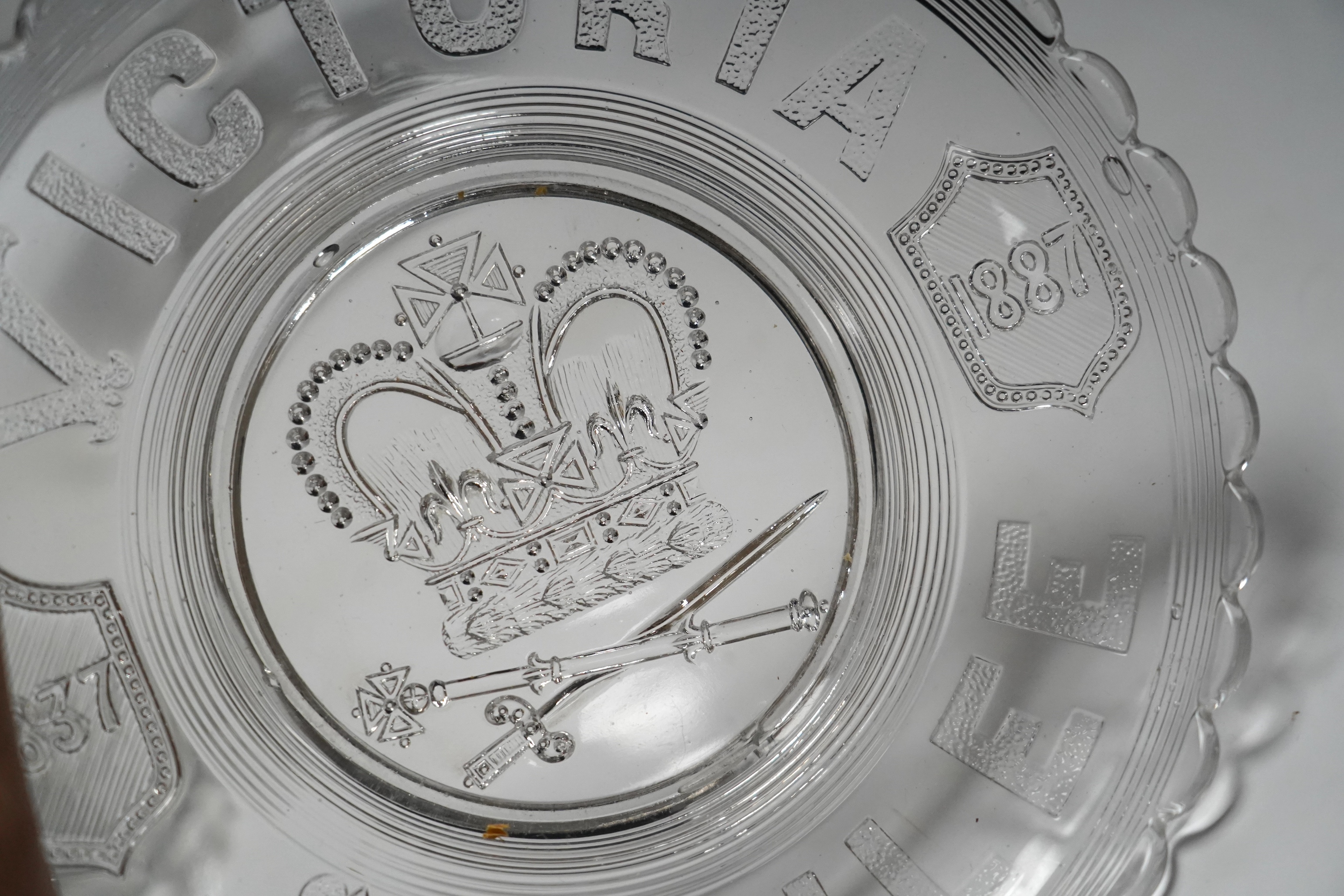 Seven press moulded glass commemorative items celebrating Queen Victoria's Diamond Jubilee. Condition - fair